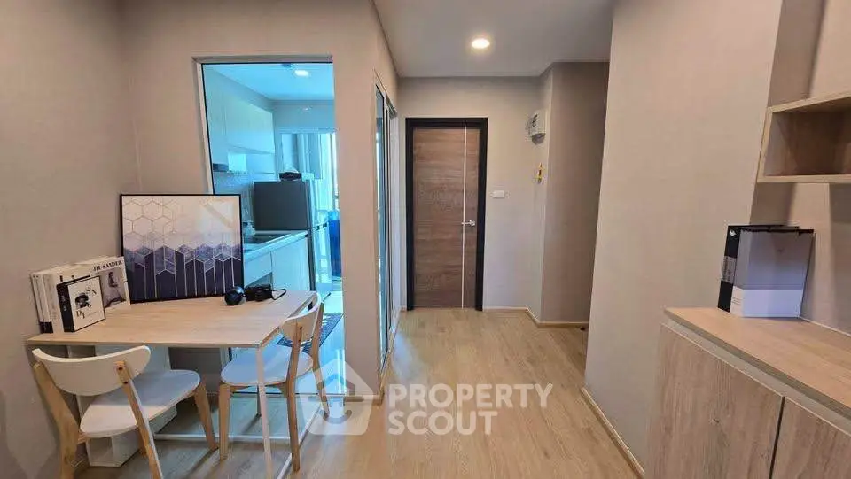 Modern apartment interior with wooden flooring and compact dining area
