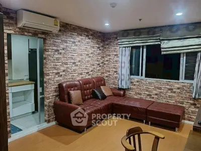 Stylish living room with brick accent wall and leather sectional sofa