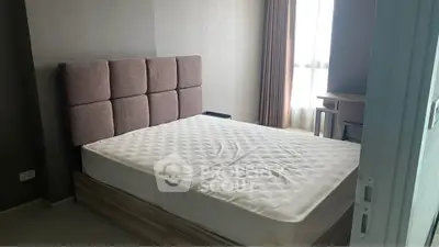 Modern bedroom with stylish headboard and natural light, perfect for a cozy retreat.