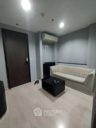 Modern living room with sleek sofa and air conditioning in stylish apartment
