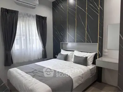 Modern bedroom with elegant design, featuring a comfortable bed and stylish decor.