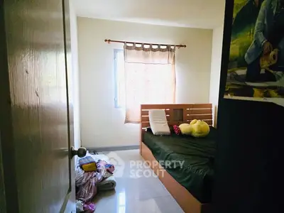 Cozy bedroom with natural light and minimalist decor