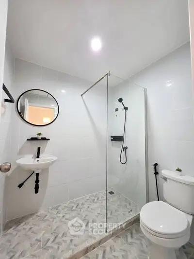 Modern bathroom with glass shower and sleek fixtures