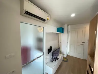 Modern compact living room with air conditioning and TV unit