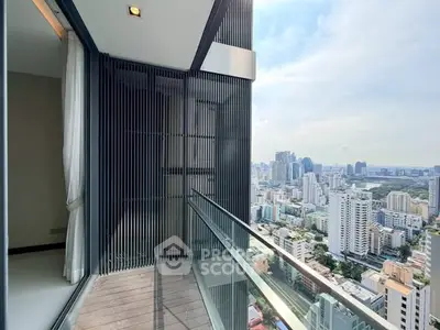 Stunning high-rise balcony with panoramic city views, perfect for urban living.