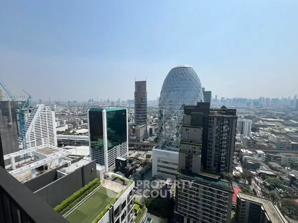 Stunning cityscape view from high-rise balcony showcasing modern architecture and skyline.