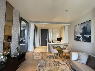 Modern living room with open kitchen, stylish decor, and elegant furniture in a luxury apartment.