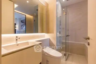Luxurious modern bathroom with sleek fixtures and elegant lighting