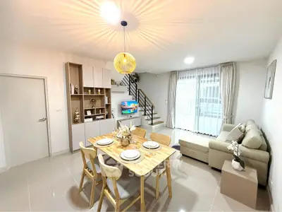 Modern open-plan living room with dining area and stylish decor