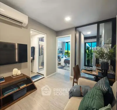 Modern apartment interior with open layout, featuring a cozy living area and stylish bedroom.