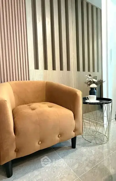 Stylish modern living room with cozy armchair and chic side table