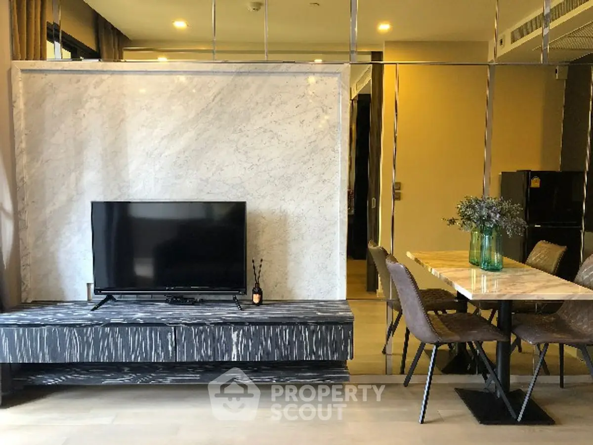 Modern living room with stylish dining area and TV setup