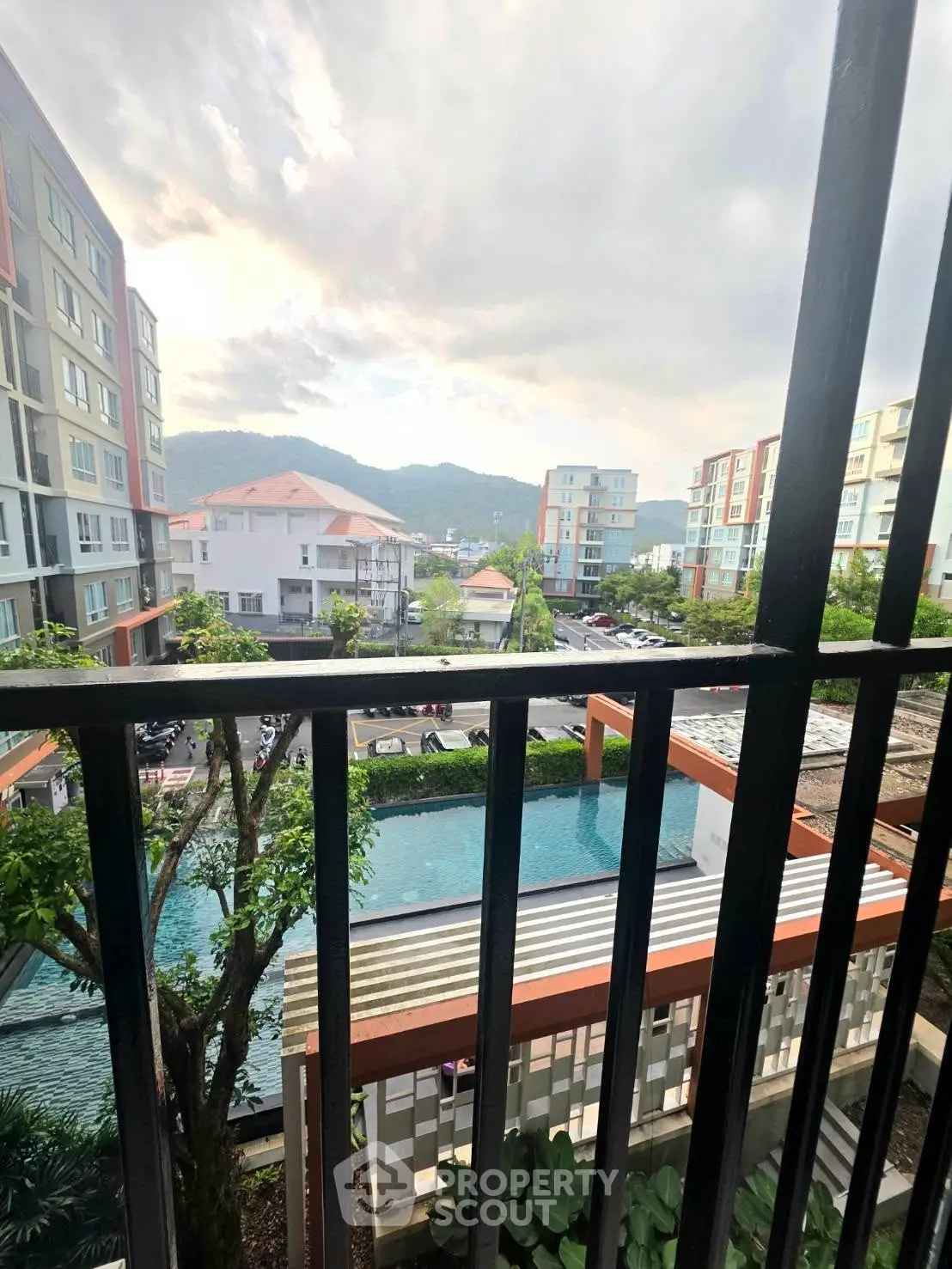 Stunning apartment view with pool and mountain backdrop