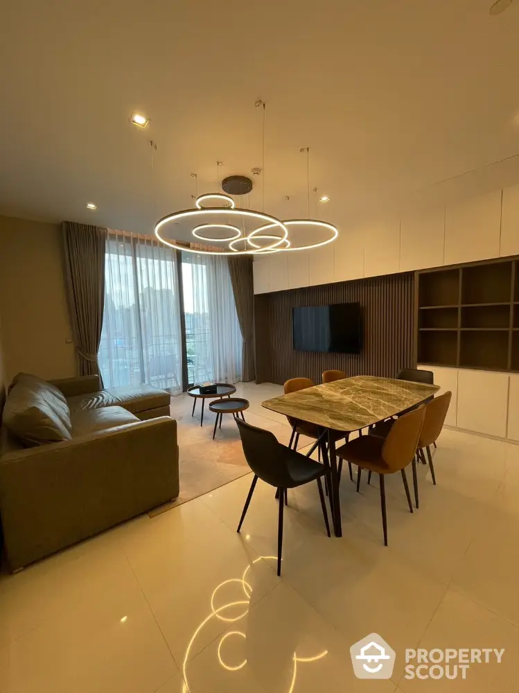 Modern living room with stylish lighting and elegant furniture in a spacious open layout.