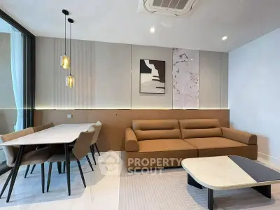 Modern living room with stylish furniture and elegant dining area