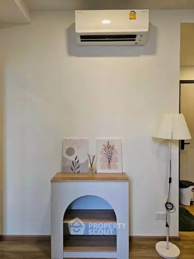 Modern interior with air conditioner, stylish decor, and elegant lighting in a cozy living space.