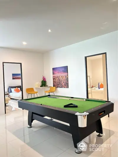 Modern interior with pool table and stylish decor in spacious living area