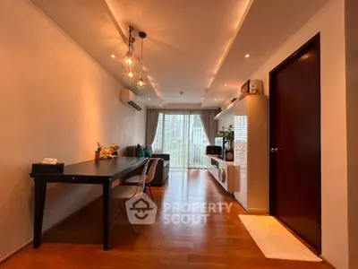 Modern living room with stylish lighting and wooden flooring