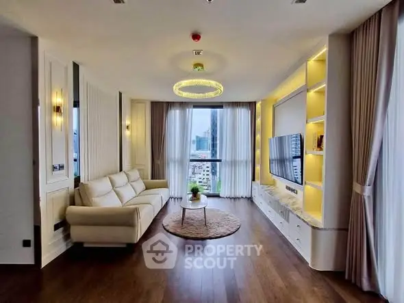 Luxurious living room with modern decor, large window view, and elegant lighting in a high-rise apartment.