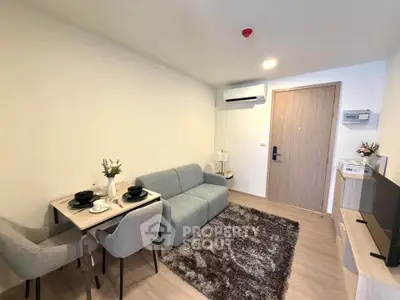 Modern living room with cozy sofa, dining area, and stylish decor