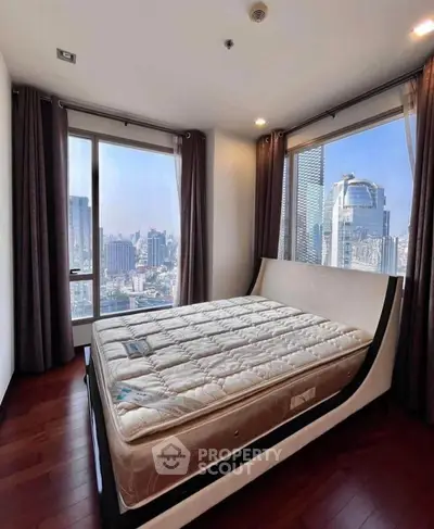 Luxurious bedroom with panoramic city views and modern design