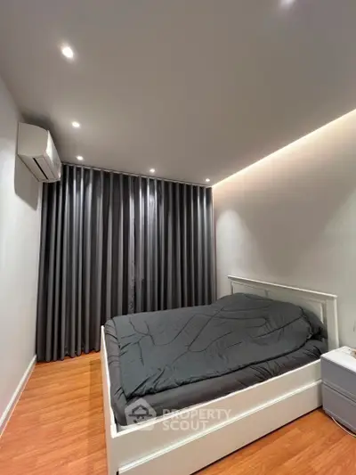 Modern bedroom with sleek design and cozy atmosphere