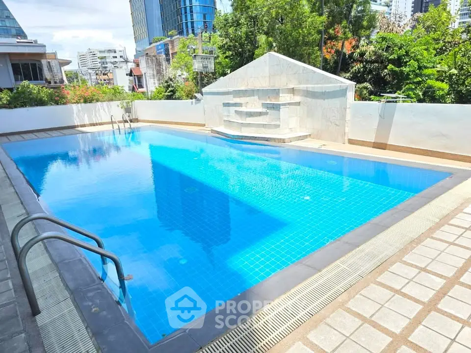 Luxurious outdoor pool with modern design in urban setting, perfect for relaxation and leisure.