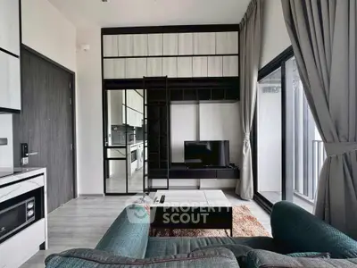 Modern living room with sleek furniture and balcony view