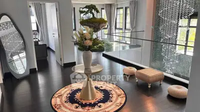 Elegant hallway with modern decor and large windows in luxury home