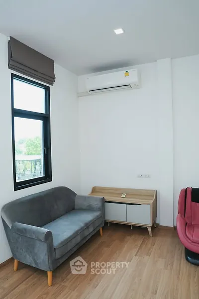 Modern living room with sleek sofa and air conditioning