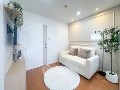 Cozy living room with modern decor and white sofa in a stylish apartment.
