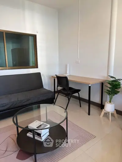 Modern living room with sleek furniture and natural light, perfect for urban living.