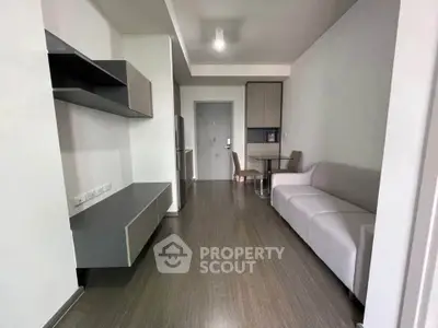 Modern living room with sleek furniture and open layout in a contemporary apartment.