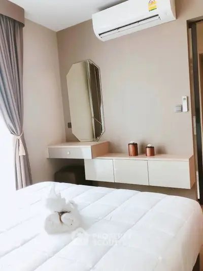 Modern bedroom with air conditioning and stylish decor in a cozy apartment.