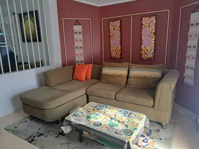 Cozy living room with stylish sectional sofa and artistic decor accents.