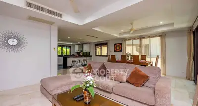 Spacious living room with modern decor and open layout, perfect for family gatherings.