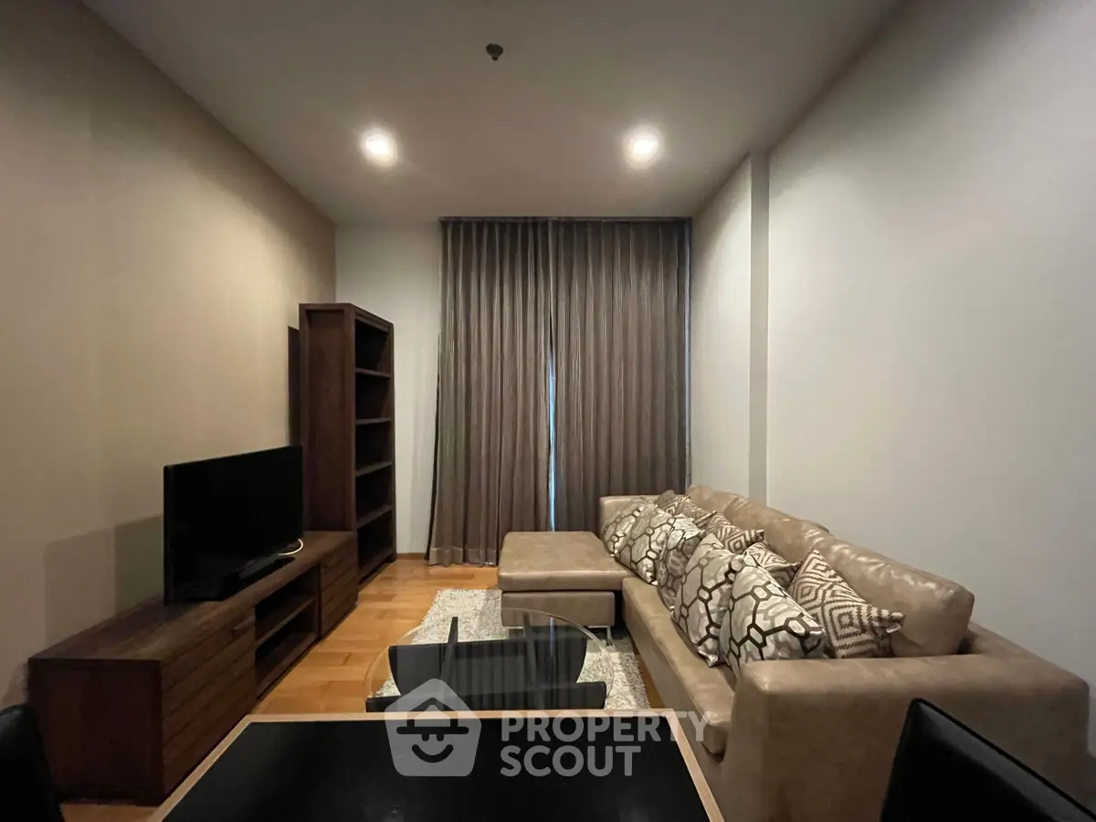 Cozy living room with modern furniture and elegant decor in a stylish apartment.