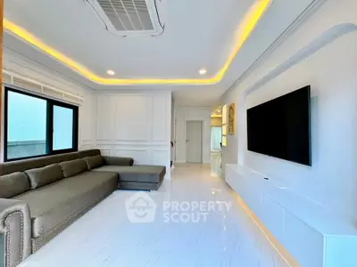 Spacious modern living room with sleek design and large sectional sofa