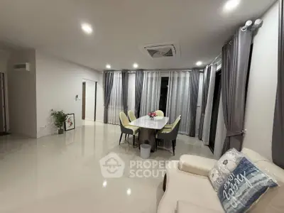 Spacious modern living room with elegant dining area and stylish decor