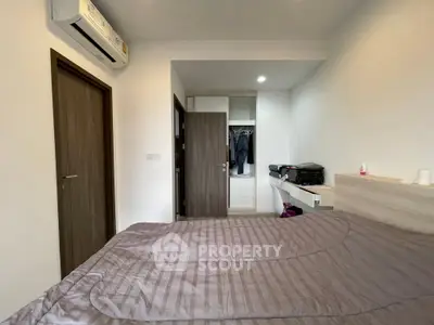 Cozy bedroom with modern air conditioning and ample storage space