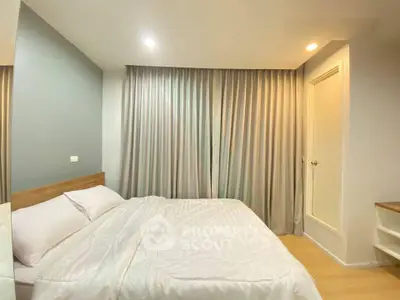 Cozy bedroom with modern decor and soft lighting, perfect for relaxation.