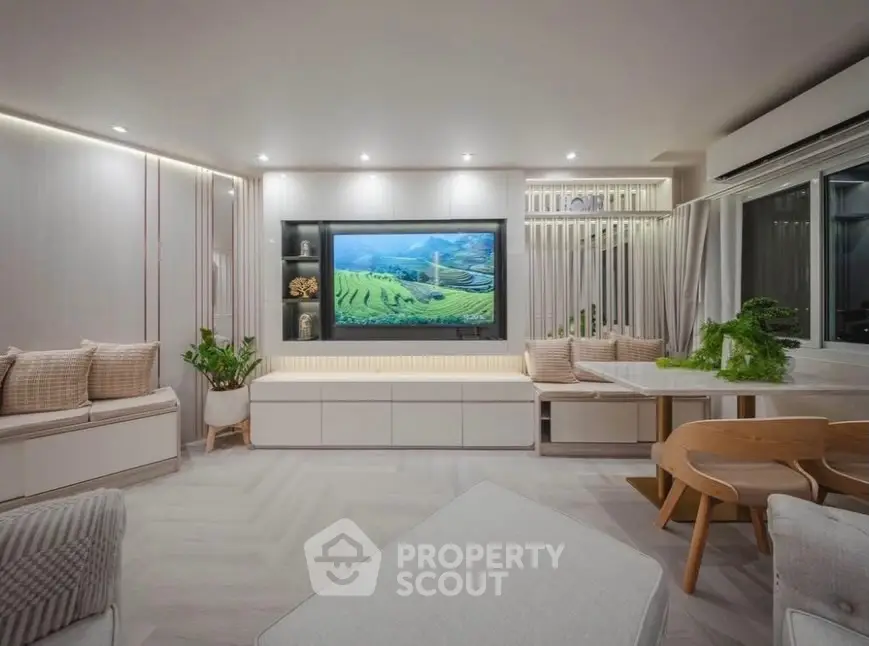 Modern living room with stylish decor and built-in entertainment center