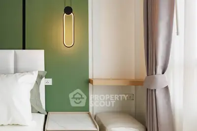 Modern bedroom with stylish lighting and elegant curtains in a contemporary apartment.