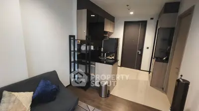 Modern apartment interior with open kitchen and cozy living area