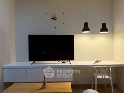 Modern living room with sleek TV setup and stylish lighting