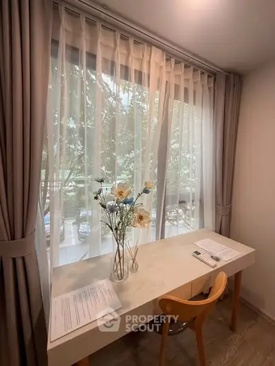 Charming study nook with natural light and elegant decor, perfect for productivity and relaxation.