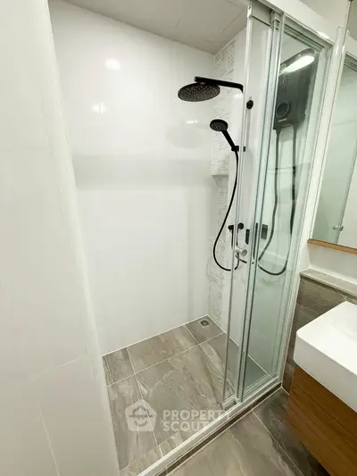 Modern bathroom with sleek shower and elegant fixtures