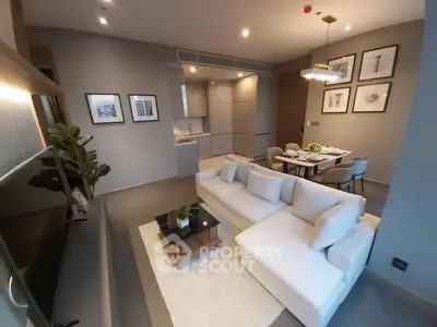 Modern living room with stylish decor and open kitchen layout in a luxury apartment.