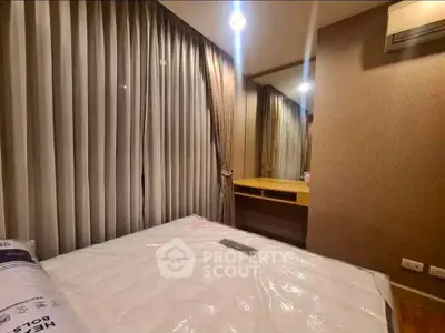 Cozy bedroom with elegant curtains and a modern desk setup