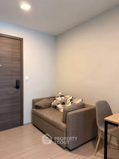 Cozy living room with modern sofa and stylish decor in a contemporary apartment.